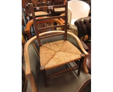 Child's beechwood ladder back chair with rush seat, together with a child's white painted tub chair 