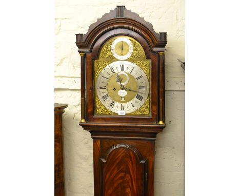 George III mahogany longcase clock the broken arch hood with brass mounted flanking pilasters above a moulded figured panelle