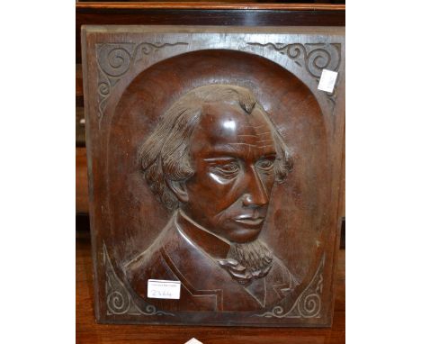 Square carved oak panel, a mahogany panel carved with a portrait and an Indian carved octagonal table top 