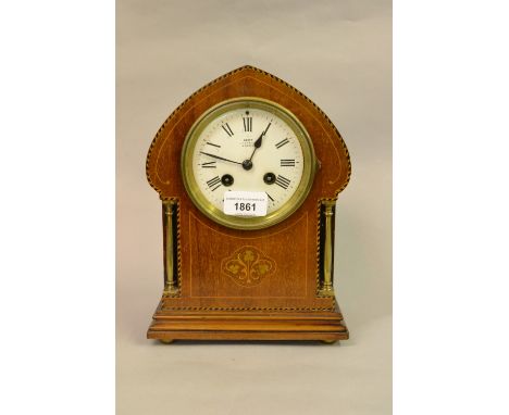 Edwardian mahogany and inlaid arch top mantel clock, the enamel dial with Roman numerals, inscribed Dent, London, with a two 