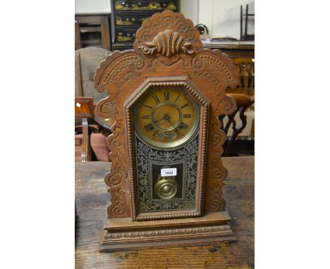 19th Century American oak two train mantel clock with a painted glazed door 