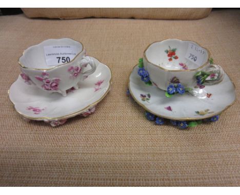 Two 19th Century Meissen floral encrusted cabinet cups and saucersVarious chips to the flowers, some have been restored on bo