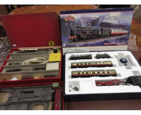 Two boxed Trix twin railway sets, Triang Railways box containing a quantity of various trains, Bachmann branch line Royal Sco