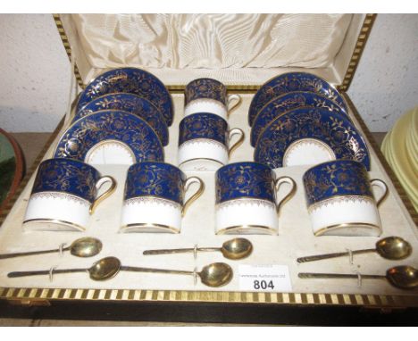 Set of six Copeland Spode blue and gilt coffee cans, together with six silver gilt coffee spoons in a fitted case (with damag