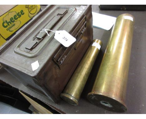Two early 20th Century brass shell cases and a metal U.S. ammunition box 