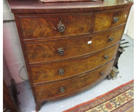 19th Century mahogany bow front chest of two short over three long graduated drawers with brass knob handles, raised on splay