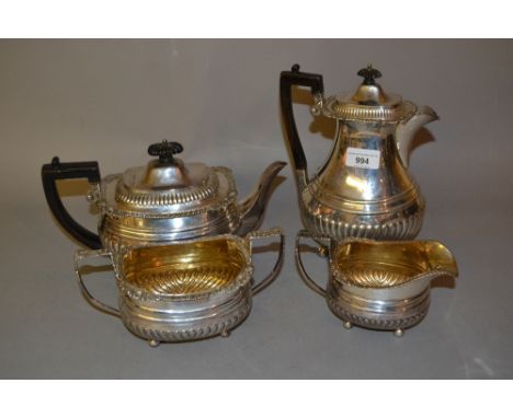 Victorian Scottish silver four piece tea service of oval half fluted design with shell pattern rims and handles, Edinburgh 18