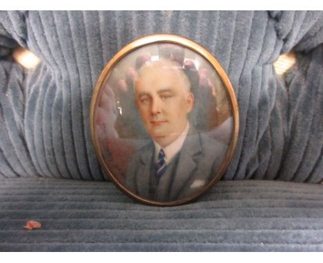 20th Century oval head and shoulder portrait miniature of an elderly gentleman in a suit, signed M. Brooks 