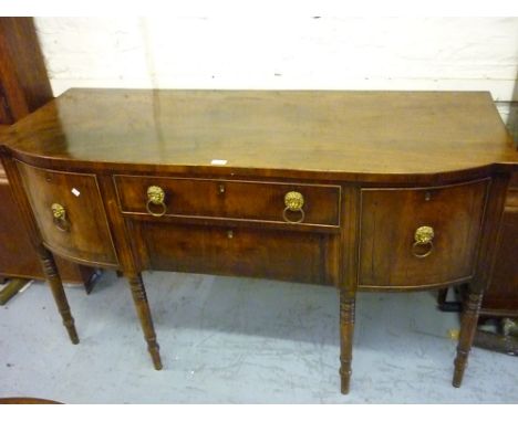 Regency mahogany semi bow fronted sideboard with two central drawers flanked by two further deep drawers with lion ring handl