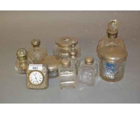 Small silver mounted dressing table clock together with various silver mounted and other dressing table bottles 