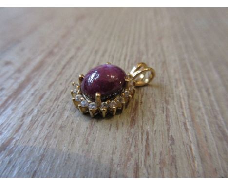 9ct Yellow gold cabochon amethyst and diamond set pendant 
