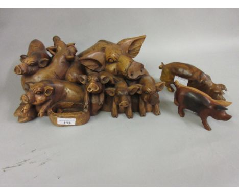 Large carved wooden group of pigs together with two other carved wooden figures of pigsThe largest item is 33cms wide x 22cms