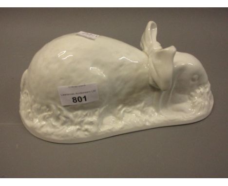 Shelley pottery white glazed jelly mould of a rabbit modelled wearing a bow and eating grass (with firing faults)25cms long, 