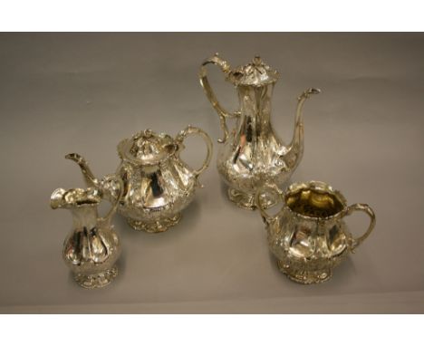 Good quality Victorian silver four piece tea and coffee service with floral embossed and engraved decoration and acorn finial