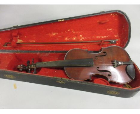 Late 19th or early 20th Century violin with a one piece 14in back bearing label Antonius Stradivarius with bow and fitted ebo