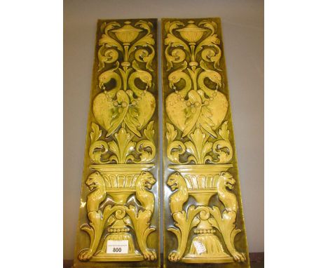 Pair of large Burmantofts Faience tile panels decorated in high relief with classical birds amidst foliage and urns, 55cms x 