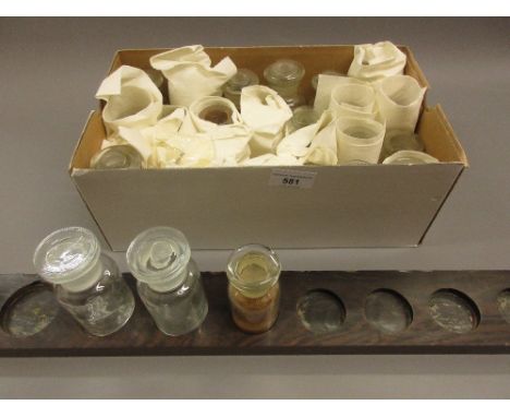 Quantity of glass spice bottles with wooden rack 