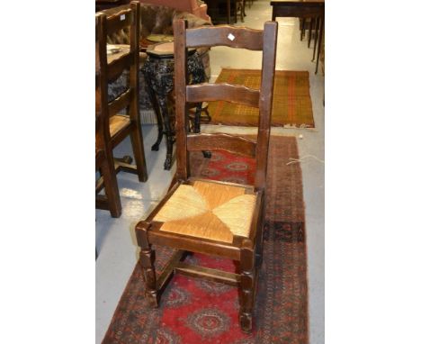 Set of six reproduction oak ladder back dining chairs with drop-in seats raised on turned supports 