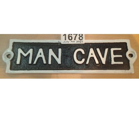 Cast iron Man Cave sign, L: 18 cm. P&amp;P Group 1 (£14+VAT for the first lot and £1+VAT for subsequent lots) 