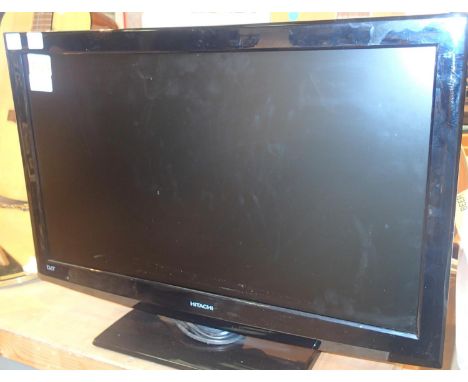 Hitachi 26 inch flat screen TV and remote control. Not available for in-house P&P, contact Paul O'Hea at Mailboxes on 01925 6