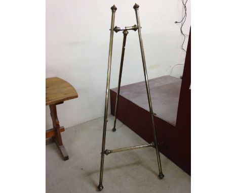 Victorian brass easel. Approx 60" tall and 24" wide at base.