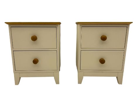 Pair of cream finish bedside lamp chests, fitted with two drawers, oak top and handlesDimensions: Height:&nbsp;57cm&nbsp; Len