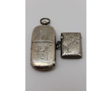 John Gilbert A Victorian silver combination vesta &amp; sovereign case, with suspension ring &amp; chased decoration, Birming