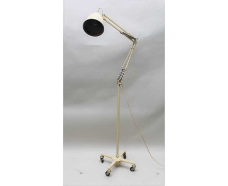 A mid-century, probably medical floor-standing mobile anglepoise inspection light finished in ivory white, standing approxima