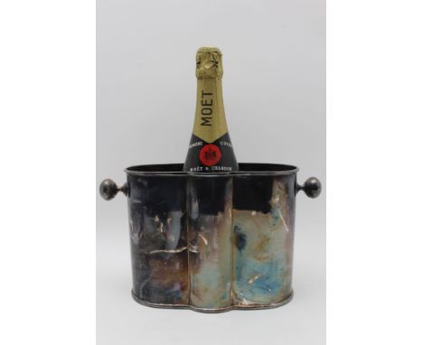 A 20th century silver plated champagne cooler, probably from a cruise liner, 17 x 22cm excluding handles, containing a full, 
