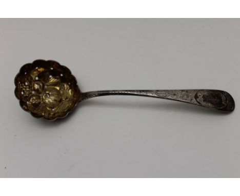 Thomas Wallis A Georgian silver sifting lade, chased handle, the bowl embossed with fruits &amp; gilded, no discernative year