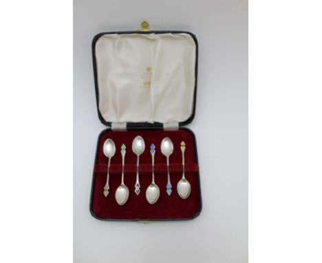 Henry Clifford Davis A set of six Art Deco silver coffee spoons, each with a harlequin of guilloche enamel diamond finials, B