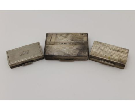 Three 20th century silver pill or snuff boxes, engine turned, the largest inscribed 'Gallagher', 6cm x 4cm, the other two, sm