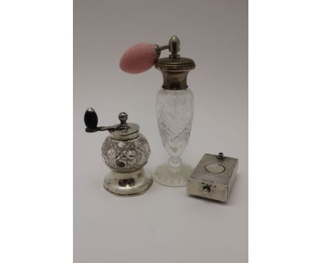 John Grinsell &amp; Sons A late Victorian silver mounted cut glass pepper grinder, London 1897, a silver mounted glass scent 