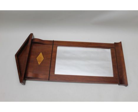 A 19th century Biedermeier walnut framed wall mirror, architectural crest, freize inset satin walnut marquetry lozenge, swept