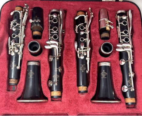 A matched pair of Buffet Bb and A wooden clarinets, in a fitted caseserial 436092 on the two longer pieces, the horn is stamp