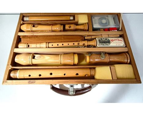 A recorder, and three different sized recorders, boxed 