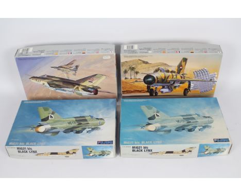 Fujimi - Four boxed 1;72 scale plastic military aircraft model kits. Lot consist of Fujimi #27021 MiG21 bis Black Lynx (x2); 