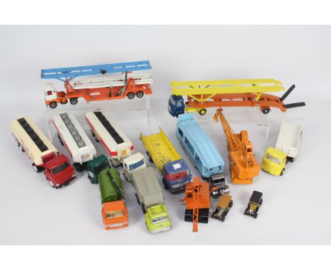 Dinky - 12 x unboxed and repainted Dinky trucks including two AEC tanker trucks, a Foden tanker truck, an AEC Hoynor car tran