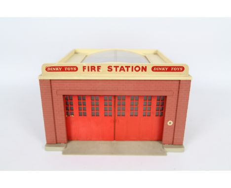 Dinky Toys - An unboxed Dinky Toys #954 Fire Station. The built plastic station comes with front sliding doors, plastic sun r