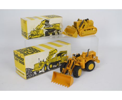 NZG - 2 x boxed CAT models, a Radlader 988 Wheeled Loader # 134 and a Kettenlader 983 Tracked Loader. # 140. The 988 model sh