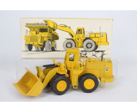 NZG - A boxed Radlader Cat 988 B Loader in 1:50 scale. # 167. The model appears Near Mint with only a couple of minor marks o