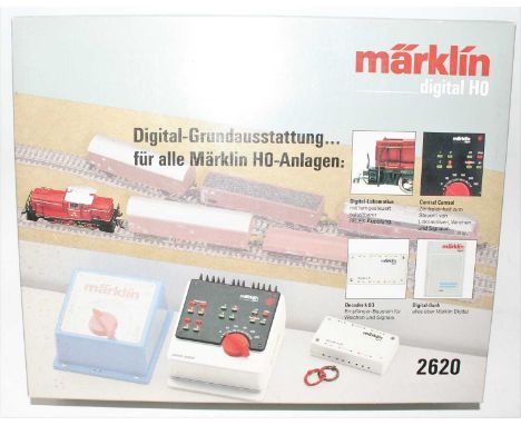 A Marklin H0 model No. 2620 train set comprising of BR365 locomotive with central control unit K83 Decoder and booklet, house