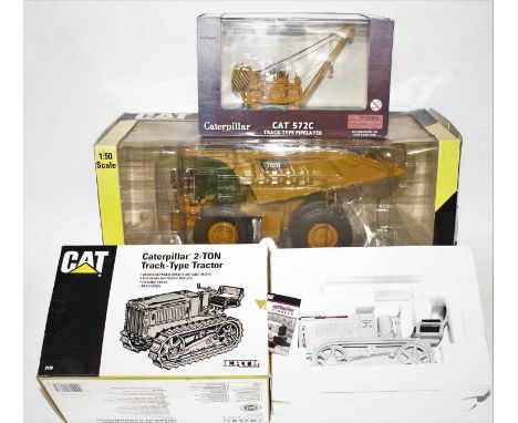 A Norscot and ERTL boxed mixed scale construction vehicle group, three boxed examples to include a Norscot Caterpillar 793D m