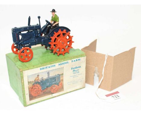 A Britains Model farm No. 127F Fordson Major tractor with spud wheels comprising of dark blue body with orange spud wheels an
