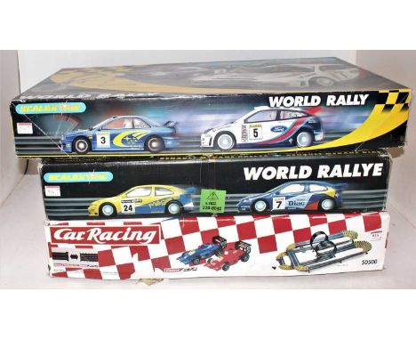 Three various boxed Carerra and Scalextric boxed slot car racing gift sets to include a Carerra Super looping car racing set,