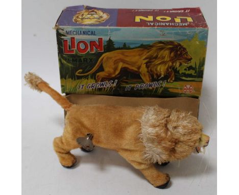 A Marx Toys mechanical, mohair and clockwork model of a growling lion housed in the original card box with pictorial lid, ful