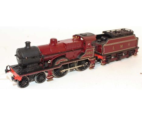A very well constructed and hand painted 00 gauge white metal kit built model of a Johnson Midland Railway 2P 4-4-0 locomotiv