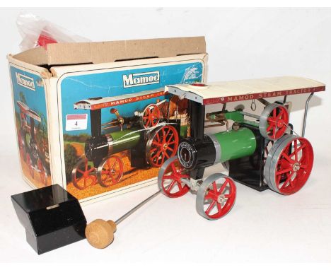 A Mamod TE1A traction engine of usual specification, comprising of green body with red spoked hubs and cream canopy, sold wit