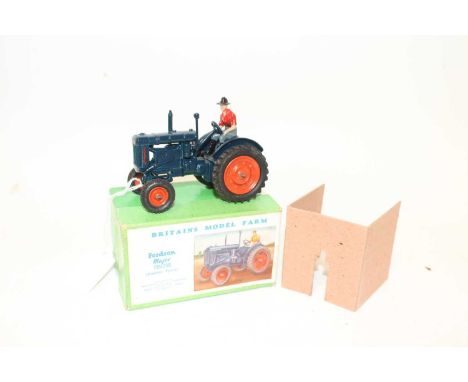 A Britains model farm No. 128F Fordson Major tractor comprising of dark blue body with orange hubs and driver figure, housed 