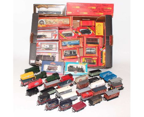 Two trays containing a quantity of various 00 gauge railways to incude boxed and loose items, mixed manufactures to include H